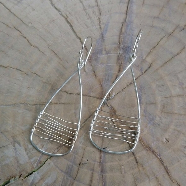 Earrings... "Eye Catchers" handmade and hammered sterling silver earrings.