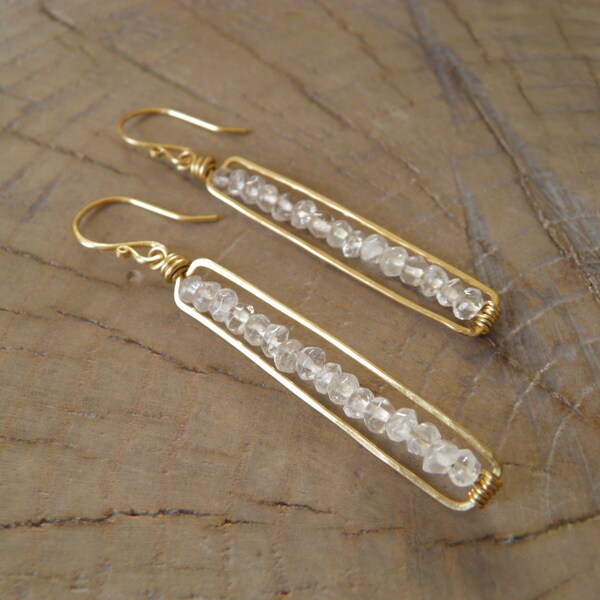 Earrings... "Line of Stars" earrings beautiful quartz faceted gemstones strung on and boxed in brass.