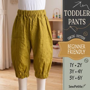 May include: Mustard yellow toddler pants with an elastic waistband and elastic cuffs at the hem. The text on the right reads TODDLER PANTS SEWING PATTERN BEGINNER FRIENDLY 1Y 2Y 3Y 4Y 5Y 6Y SewPetite.