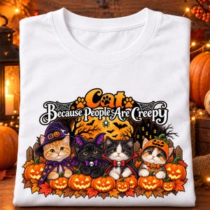 May include: A white t-shirt featuring a graphic of four kittens dressed in Halloween costumes, including a witch, bat, vampire, and pumpkin. The text reads Cat Because People Are Creepy, set against a backdrop of pumpkins and a haunted house.