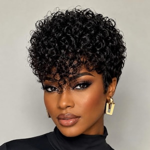 May include: A short, black, curly hairstyle with tight, defined ringlets that frame the forehead and crown. The hair is cropped closely at the sides and back, featuring a voluminous, textured top section that creates a rounded, layered silhouette.