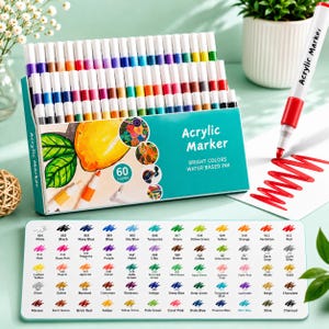 May include: A set of 60 acrylic markers in a teal box with white text reading Acrylic Marker, Bright Colors, Water Based Ink. The box displays a lemon illustration and colour swatches. A colour chart card and a red marker are included.