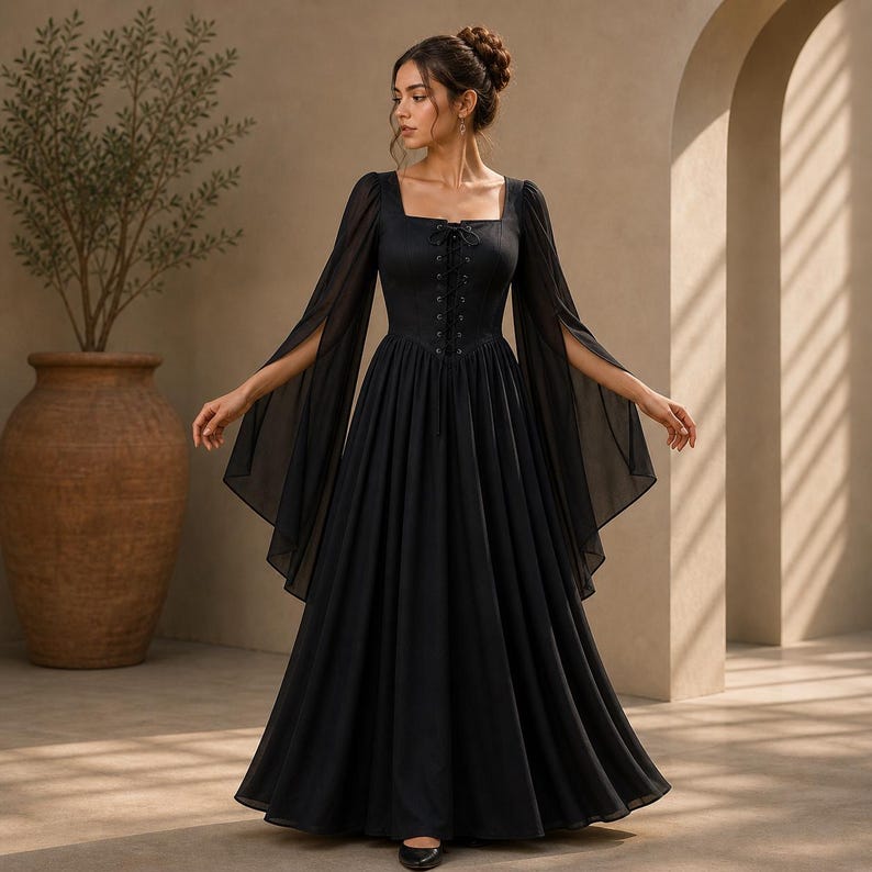 May include: A floor-length black dress featuring a square neckline with a lace-up corset-style bodice and long, flowing, split sleeves. The garment has a fitted waist that transitions into a full, floor-length skirt made of a lightweight fabric.