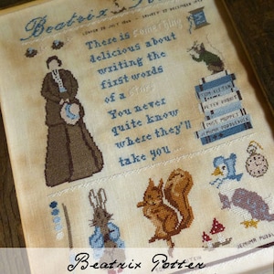 May include: Cross-stitch embroidery featuring Beatrix Potter characters, including Peter Rabbit, Jemima Puddle-Duck, and a squirrel. The design includes a quote from Beatrix Potter: "There is something delicious about writing the first words of a story. You never quite know where they'll take you."