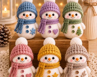 May include: Six crocheted snowman figurines, each wearing a matching knit hat with a white pom-pom and a scarf. The snowmen feature orange carrot noses, black eyes, pink cheeks, and two buttons on their bodies, with unique decorative shapes like stars, hearts, and trees.