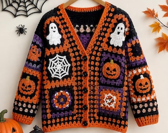 May include: A long-sleeve crochet cardigan featuring a V-neckline and five black buttons. The garment is constructed from square patches in black, orange, and purple, displaying motifs of white ghosts, white spiderwebs, and orange jack-o'-lanterns.