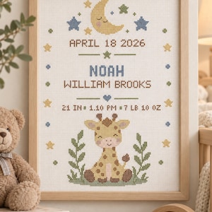 May include: A framed cross-stitch birth announcement featuring a yellow crescent moon, blue and green stars, and a giraffe. Text includes APRIL 18 2026, NOAH WILLIAM BROOKS, and birth details 21 IN, 1.10 PM, 7 LB 10 OZ, all stitched on white fabric.