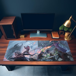 May include: A rectangular desk mat featuring a detailed fantasy battle scene with multiple characters, including warriors and spellcasters, in shades of blue, purple, and orange. The mat is positioned on a wooden desk surface in front of a computer monitor.