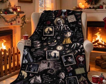 May include: A black fleece throw blanket featuring a collage of characters and motifs from various animated films, including Beetlejuice, Coraline, and Edward Scissorhands, with printed text quotes scattered throughout the dark patterned design.