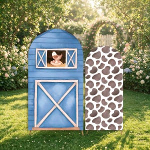 May include: Two arched display panels featuring a blue barn design with a chicken in a window and a white panel with a brown cow print pattern. The barn panel includes a large door with white trim and a small window showing a chicken in a nest.
