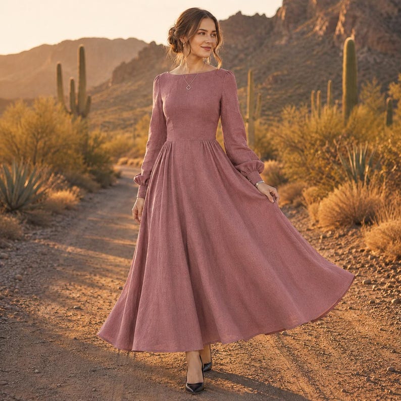 Puede incluir: Un vestido largo de color rosa polvoriento con mangas largas, cuerpo ajustado, cuello redondo y una falda amplia y fluida. La prenda est&aacute; confeccionada en un tejido texturizado e incluye mangas largas con pu&ntilde;os fruncidos y sencillos.