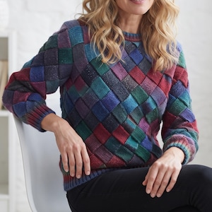 May include: A long-sleeved knit sweater featuring a multi-colored basketweave pattern in shades of deep red, forest green, royal blue, and purple. The garment has a round neckline and ribbed cuffs at the wrists and hem, creating a textured appearance.