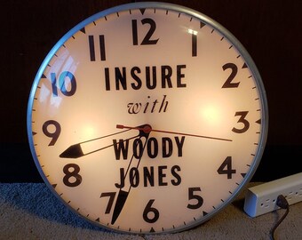 Vintage "Insure with Woody Jones" 15 inches bubble clock, original face w/ new motor pre - 1970s.  Fully operational previously used