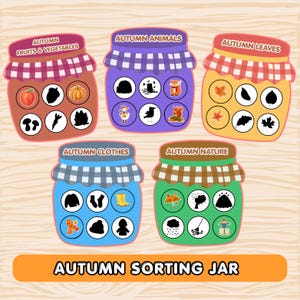 Peut inclure: Cinq bocaux colorés étiquetés Autumn Fruits & Vegetables, Autumn Animals, Autumn Leaves, Autumn Clothes et Autumn Nature. Chaque bocal contient six icônes circulaires présentant diverses silhouettes et illustrations liées à la saison d'automne.