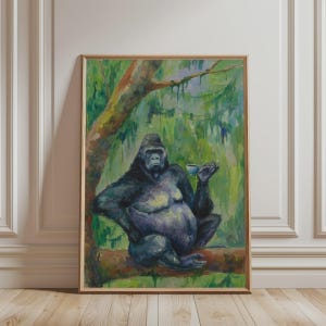 May include: A framed painting depicting a dark-furred gorilla sitting on a tree branch in a lush green forest. The gorilla is holding a small, light-colored teacup in one hand, with its other hand resting on its hip, set against a vibrant background.