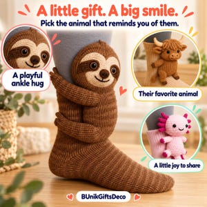 May include: A brown knit sock featuring a plush sloth attached to the side, with additional circular insets showing a brown highland cow and a pink axolotl attached to socks. Text reads: A little gift. A big smile. BUnikGiftsDeco.