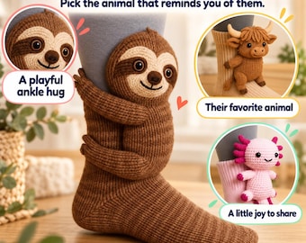 May include: A brown knit sock featuring a plush sloth attached to the side, with additional circular insets showing a brown highland cow and a pink axolotl attached to socks. Text reads: A little gift. A big smile. BUnikGiftsDeco.