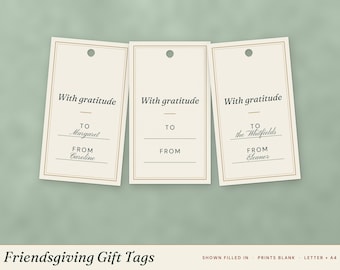 May include: Three rectangular cream-colored gift tags with a thin gold border and a hole at the top. Each tag features the black text With gratitude, TO, and FROM with lines for writing names. Some tags show handwritten names in black ink.