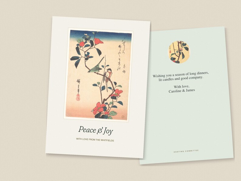 Op de afbeelding: Een gevouwen wenskaart met een illustratie in Japanse stijl van vogels op een bloeiende tak met de tekst Peace & Joy en With love from the Whitfields. De binnenzijde toont de tekst Wishing you a season of long dinners, lit candles and good company. With love, Caroline & James.