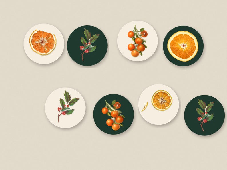 May include: A set of seven circular coasters featuring botanical illustrations. The designs include orange slices, clusters of oranges on branches, and holly sprigs with red berries, set against either a cream or a dark green background.