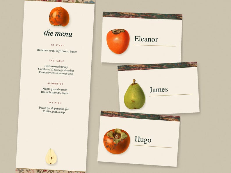 May include: A vertical menu card titled the menu with a list of food items and three rectangular place cards featuring illustrations of a persimmon or pear, with the names Eleanor, James, and Hugo printed next to the fruit illustrations.