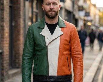 May include: A leather jacket featuring a color-blocked design with a green left side, a white center panel, and an orange right side. The jacket has a notched collar, a diagonal front zipper closure, and a solid black waistband at the bottom hem.