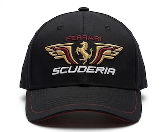 May include: A black baseball cap featuring an embroidered gold prancing horse emblem flanked by stylized gold and maroon wings. The word FERRARI is stitched in red above the emblem, and SCUDERIA is embroidered in white below. The brim has red stitching.