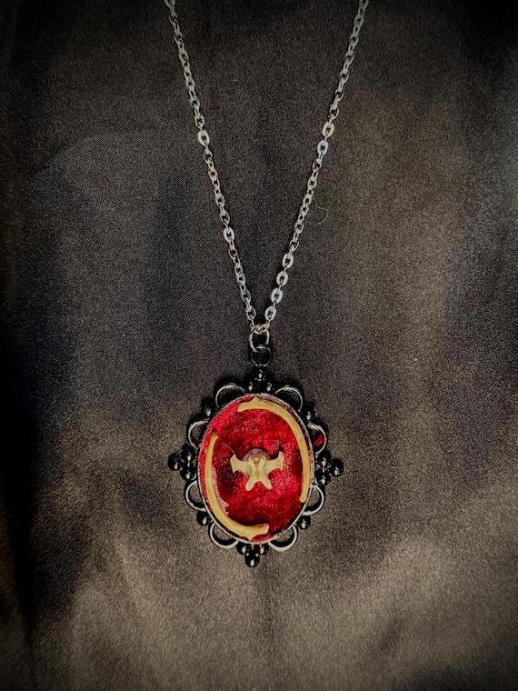 Actual mink bones handcrafted into a gothic pendant — vulture culture jewelry that's genuinely one-of-a-kind and unsettling in the best way.