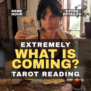 May include: A tarot card featuring a sun, two figures, and a mountain landscape held up, with text overlays reading SAME HOUR, EXTRA DETAILED, EXTREMELY WHAT IS COMING? TAROT READING, and several other tarot cards spread out on a wooden table.