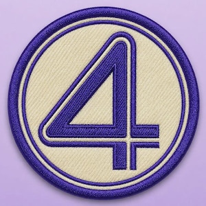 May include: A circular embroidered patch featuring a bold, dark purple number four centered on a cream-colored background. The patch is framed by a thick, dark purple stitched border, creating a clean, defined edge for this circular design.