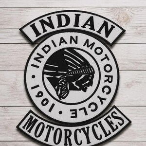 May include: A three-piece embroidered patch set featuring the Indian Motorcycle logo. The central circular patch displays a profile of a person wearing a headdress with the text Indian Motorcycle 1901. Two curved rocker patches read Indian and Motorcycles.