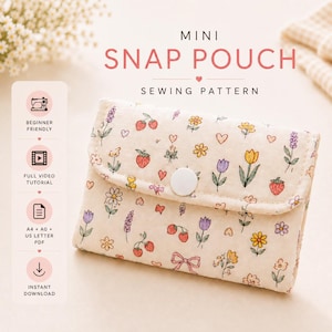 May include: A mini snap pouch sewing pattern featuring a cream-colored fabric with a repeating print of strawberries, flowers, hearts, and bows. The pouch has a white snap button closure. Text on the image reads MINI SNAP POUCH SEWING PATTERN.