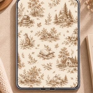 May include: A digital tablet displaying a cream-colored background with a repeating brown ink illustration pattern featuring small cottages, pine trees, pumpkins, a fox, stacks of books, and leafy branches in a detailed, sketch-like style.