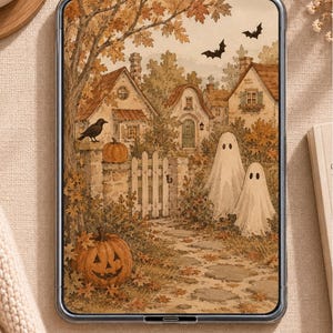 May include: A digital tablet displaying an autumn-themed illustration of a stone path leading to cottages, featuring two white ghosts, a carved jack-o'-lantern, a black crow perched on a stone pillar, and two black bats flying in the sky.