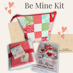 May include: A sewing kit for making a heart-shaped zipper pouch. The kit includes fabric squares in red, green, and white with a floral pattern, a zipper, and a pattern for the pouch. The pattern is titled "Be Mine Heart Zipper Pouch" and is sold separately.