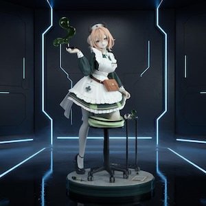 May include: A collectible anime-style figure of a character dressed in a dark green and white nurse uniform with a brown pouch, sitting on a rolling stool. The figure has short light hair, holds a translucent green liquid, and stands on a base.