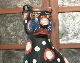 tall wooden carved cats