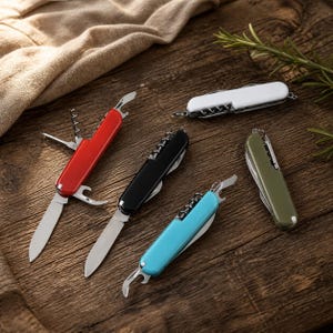 May include: Five multi-tools with folding metal blades and various implements. The handles are coloured red, black, light blue, olive green, and white. Each tool features a small metal ring at one end and includes a corkscrew and bottle opener.