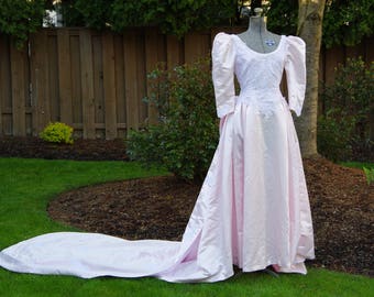 Vintage Pale Pink Wedding Dress with Lace Detailing, Long Train, Large Rear Bow, and Leg o&#39; Mutton Sleeves