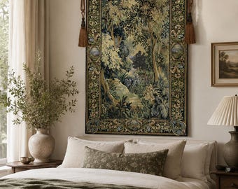 May include: A rectangular wall tapestry featuring a detailed forest landscape scene with lush trees and foliage, enclosed by a decorative floral border. The tapestry is suspended from a black metal rod with brown tassels on each side.