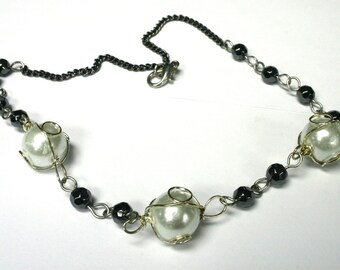 Caged Pearl Hematite Necklace