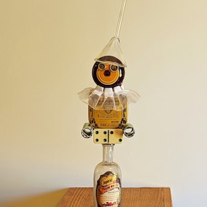 Rococo - Mixed Media Sculpture, Re-Purposed Fun Clown of Glass Funnel, Yo-Yo, Typewriter Tin, Metal Springs, Dominos, Glass Bottle & Dish