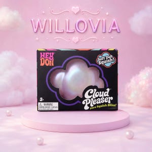 以下が含まれることがあります： HEY DONおよびCLOUD PLEASER pure Squish Blissと書かれた黒い長方形の箱。雲の形をした切り抜きから、虹色に輝く真珠のような白いスクイーズ玩具が見える。パッケージにはSoft Doh Squishのラベルと警告文が記載されている。
