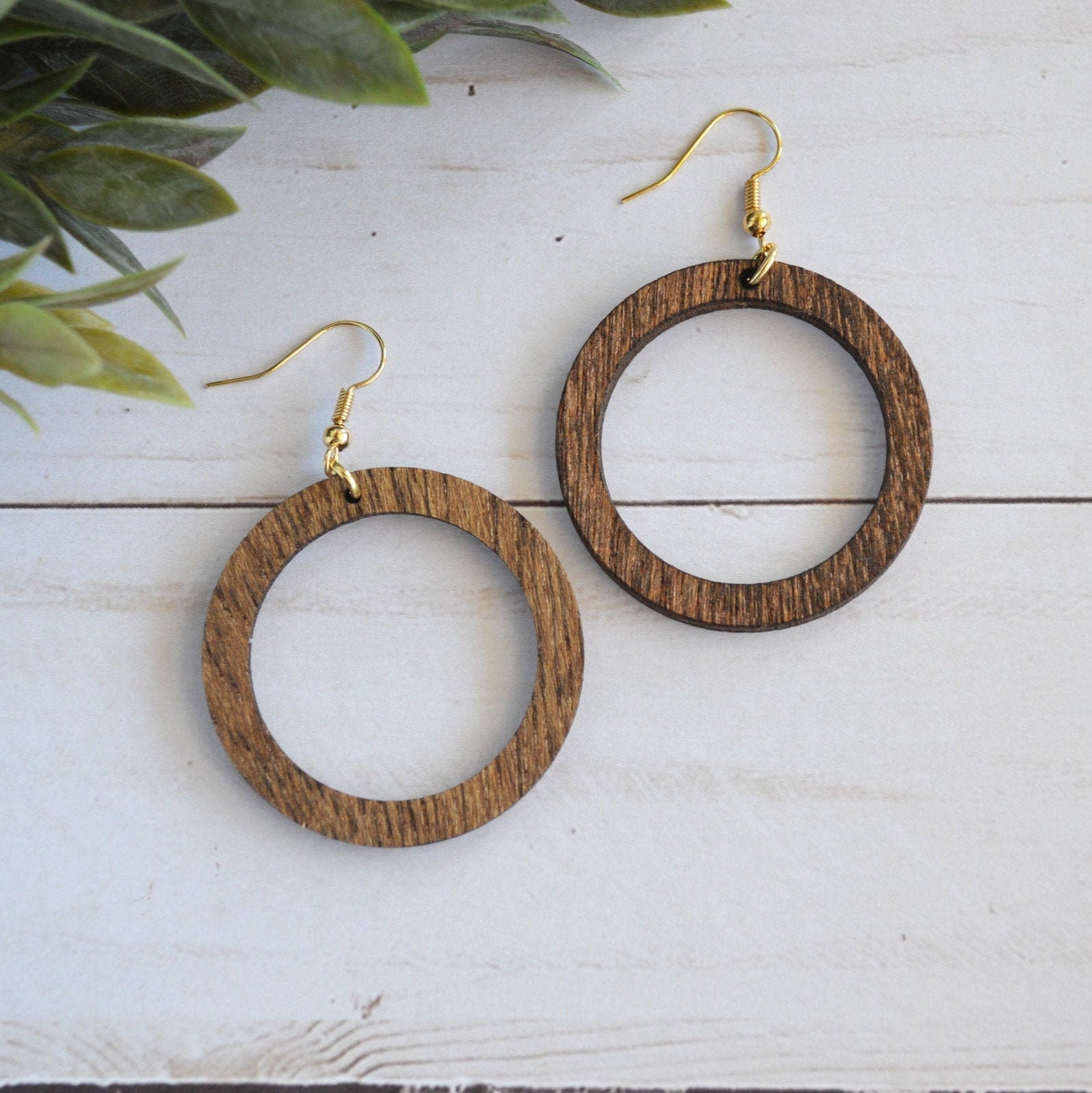 Gold-tone 20MM Laser Cut Twisted Hoop Earrings | Claire's