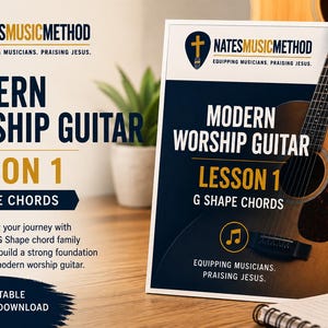 May include: A printed instructional guide titled Modern Worship Guitar Lesson 1 G Shape Chords by NatesMusicMethod. The cover features a dark blue background with white and gold text, a musical note icon, and a graphic of an acoustic guitar.