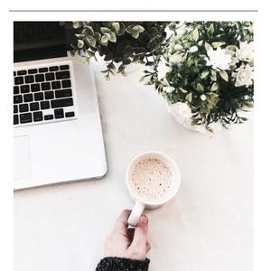 May include: A digital guide titled EASY FMLA GUIDE featuring a laptop, a white mug filled with a beige beverage, and a potted plant with green leaves and white flowers. The bottom text reads LeaveMadeEasy - Employee Friendly Leave Support.