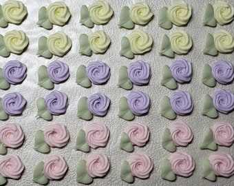 Royal icing flowers for cookie decorating, swirl roses with leaves, pastel pink, purple and yellow