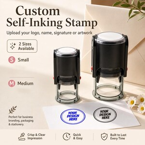 May include: Two black self-inking stamps in small and medium sizes. The text Custom Self-Inking Stamp is visible. Below, a white card displays two circular impressions with the text YOUR DESIGN HERE in blue and black ink respectively.