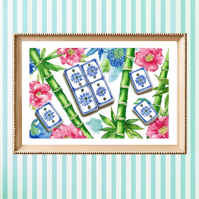May include: A framed print featuring a watercolor design of blue and white dominoes with floral and bamboo accents. The artwork includes pink flowers, green bamboo stalks, and blue floral elements on a white background.