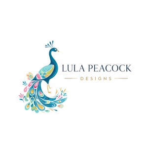 May include: A colorful peacock illustration with a blue body, teal wings, and a vibrant tail featuring pink, yellow, and teal accents. The text "LULA PEACOCK DESIGNS" is displayed in navy blue with gold lines.